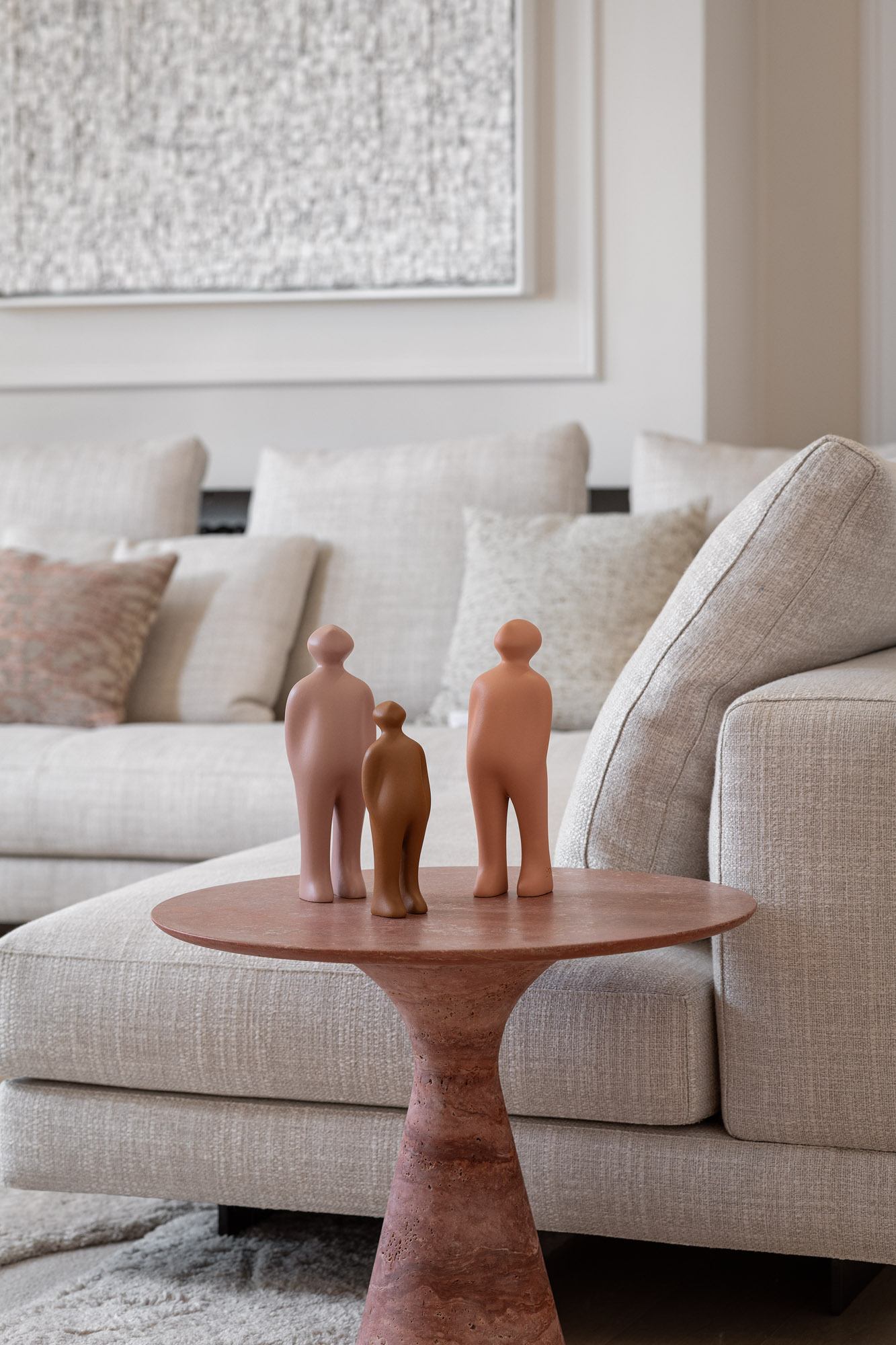 The Visitor small ceramic sculptures styled in an earth-toned living room